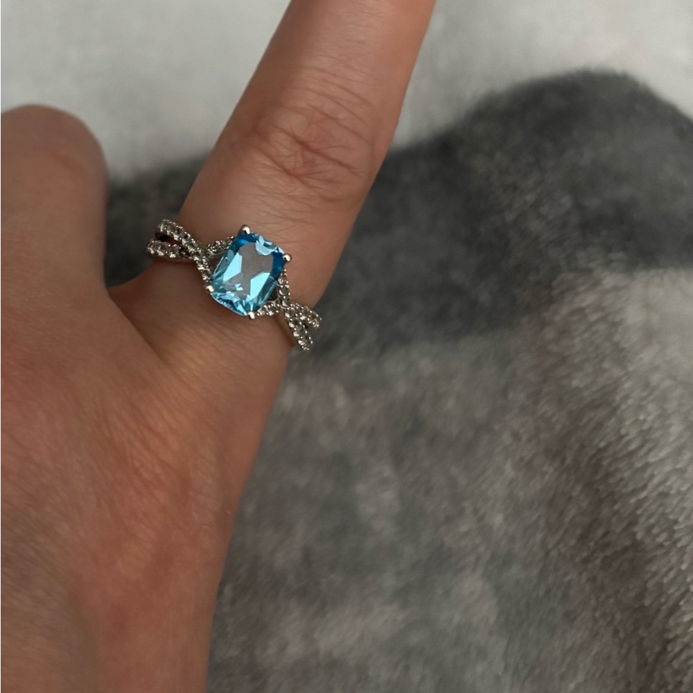 Elegant lab created blue topaz sterling silver ring